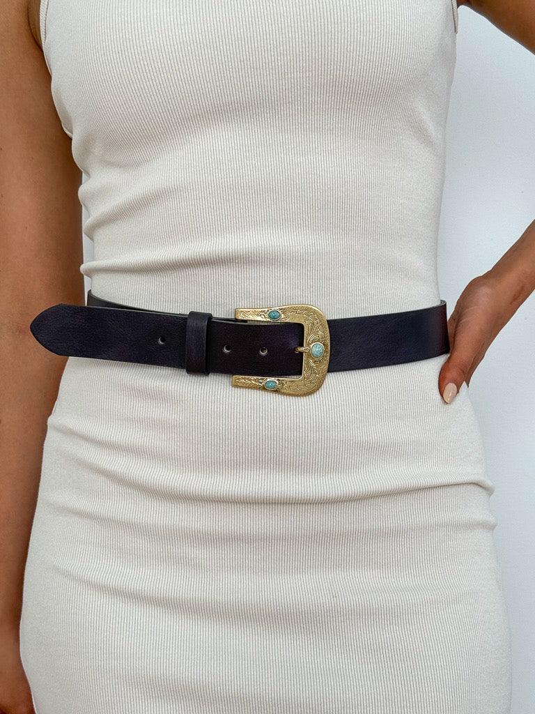 western-inspired buckle featuring shiny gold hardware with eye-catching inset turquoise