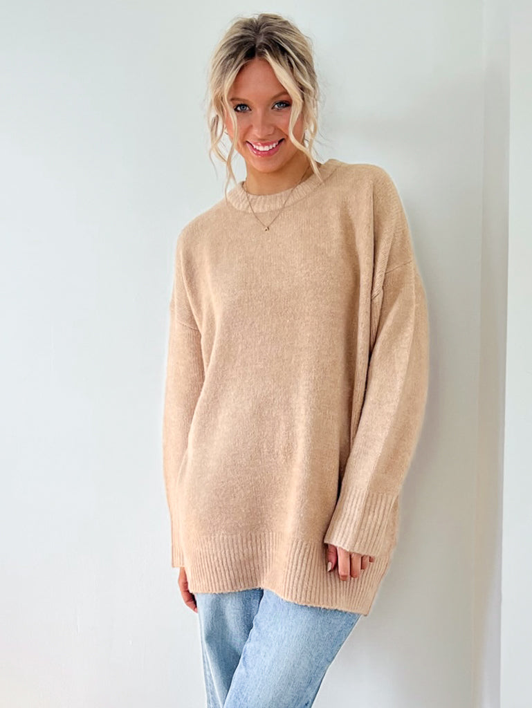This oversized sweater is a classic silhouette in a perfectly neutral tan made from ultra soft knit