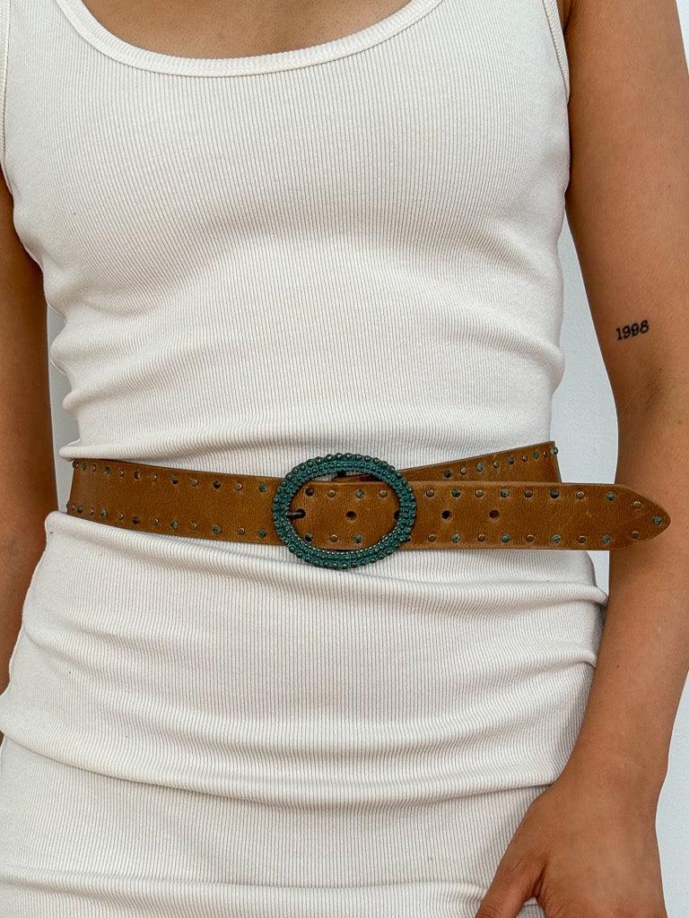 oval buckle that has the look of copper that has oxidized to a beautiful greenish blue hue